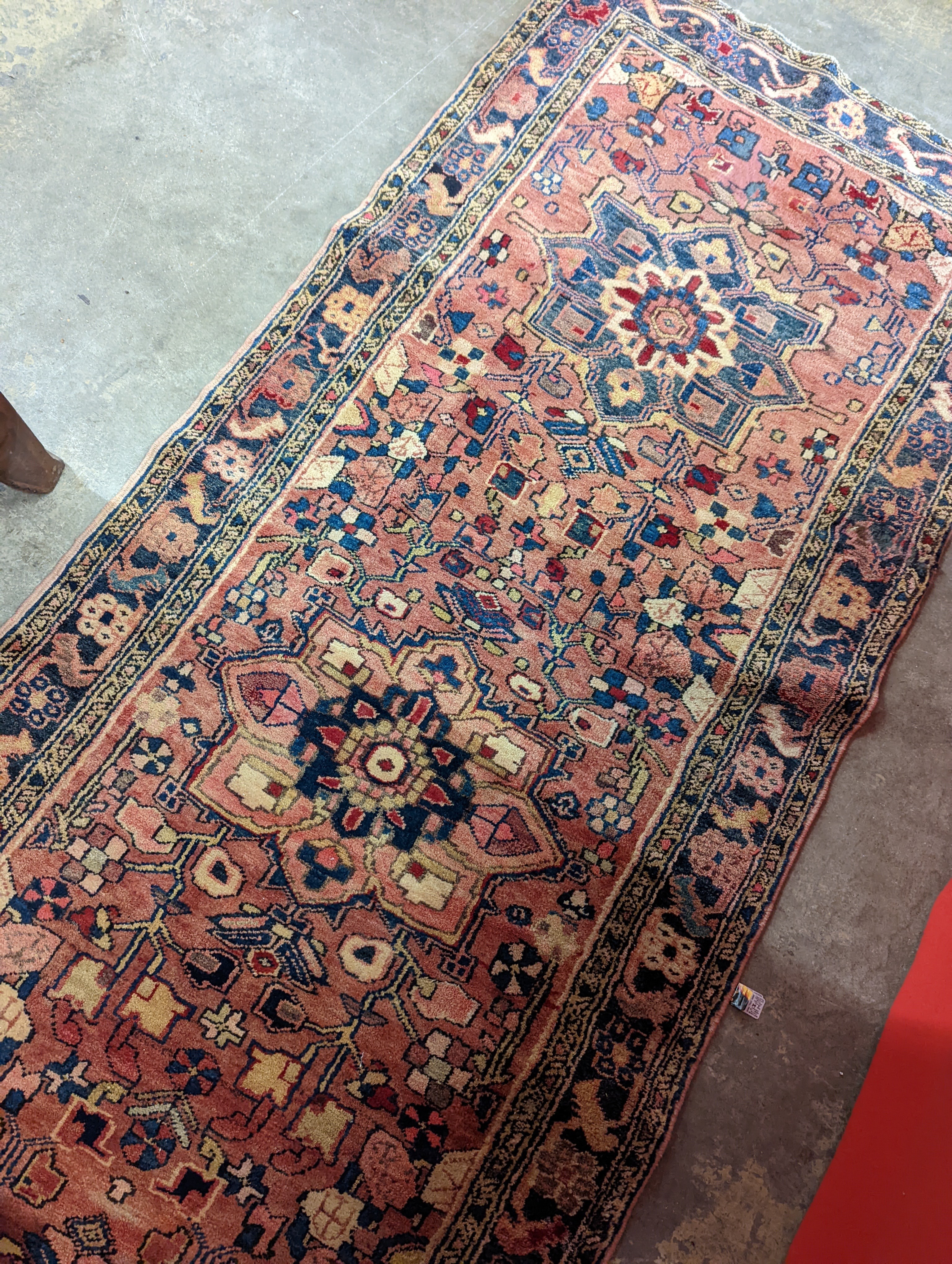 A Karajeh red ground runner, 300 x 100cm